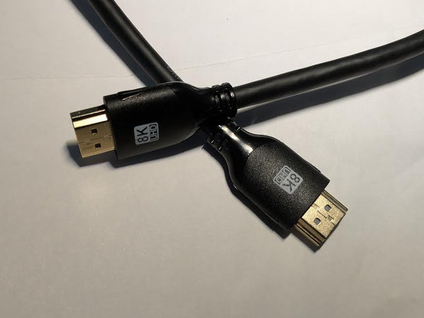 HDMI cable with 8K resolution label on a neutral background